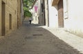 Senior man walking in a medieval street in Trujillo