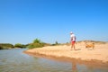 Senior man walking with old dog at beach Royalty Free Stock Photo