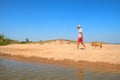 Senior man walking with old dog at beach Royalty Free Stock Photo