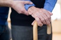 Senior Man With Walking Stick Being Helped By Care Worker Royalty Free Stock Photo