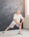 Senior man warmup stretching training indoors Royalty Free Stock Photo