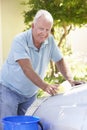 Senior Man Washing Car In Drive Royalty Free Stock Photo
