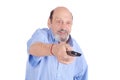 Senior man watching tv with remote control Royalty Free Stock Photo