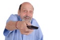 Senior man watching tv with remote control Royalty Free Stock Photo