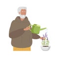 Senior man watering domestic plants. Caucasian elderly man with watering can takes care of domestic plants. Home