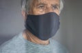 Senior man wearing  a facemask during coronavirus and flu outbreak Royalty Free Stock Photo