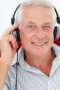 Senior man wearing headphones Royalty Free Stock Photo