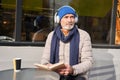 Senior man wearing headphones enjoying of his favorite book Royalty Free Stock Photo