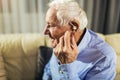 Senior man wearing hearing aid Royalty Free Stock Photo