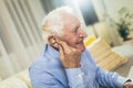 Senior man wearing hearing aid Royalty Free Stock Photo