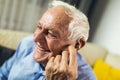 Senior man wearing hearing aid Royalty Free Stock Photo