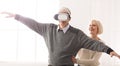 Senior man wearing virtual reality goggles at home Royalty Free Stock Photo