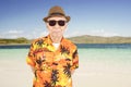 Senior man wears summer clothes on the beach Royalty Free Stock Photo