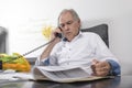 Senior man with white shirt phoning Royalty Free Stock Photo