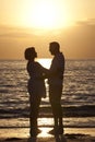 Senior Man & Woman Couple on Beach at Sunset Royalty Free Stock Photo