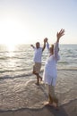 Senior Man & Woman Couple Sunset on Beach Royalty Free Stock Photo