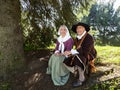 Senior man and woman dressed as characters from the 17th Century French regime in New France
