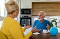 Senior man and woman drinking coffee at home Royalty Free Stock Photo