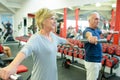 senior man and woman exercising in gym Royalty Free Stock Photo