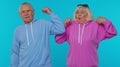 Senior man woman grandparents showing biceps feeling power strength to fight for rights, success win