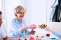 Senior man and woman having breakfast. Sunny morning. Royalty Free Stock Photo