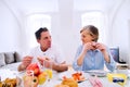 Senior man and woman having breakfast. Sunny morning. Royalty Free Stock Photo