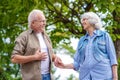 Senior man and woman relaxing in nature Royalty Free Stock Photo