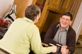 Senior man and woman talking in kitchen Royalty Free Stock Photo