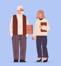 senior man woman teachers couple standing together and discussing during meeting education day concept full length Royalty Free Stock Photo