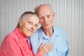 Senior Man, Woman with their Caregiver at Home. Royalty Free Stock Photo