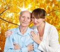 Senior Man, Woman with their Caregiver at Home. Royalty Free Stock Photo
