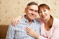 Senior man, woman with their caregiver at home. Royalty Free Stock Photo