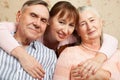 Senior man, woman with their caregiver at home. Royalty Free Stock Photo