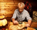 Senior man in wooden interior