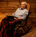 Senior man in wooden interior Royalty Free Stock Photo