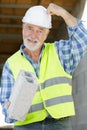 Senior man working with cement bloc Royalty Free Stock Photo