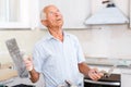 Man determining scope of plastering works