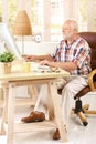 Senior man working in his study Royalty Free Stock Photo