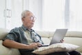 Senior man working with laptop computer at home Royalty Free Stock Photo