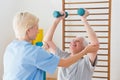 Senior man working out with his therapist Royalty Free Stock Photo