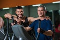 Senior man working with personal trainer in gym Royalty Free Stock Photo