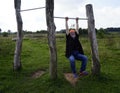 Hanging senior man on a barrier  of a fitness track Royalty Free Stock Photo