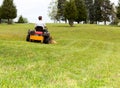 Senior man on zero turn lawn mower on turf Royalty Free Stock Photo