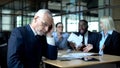 Senior manager feeling tired of arguing colleagues office, work stress, burnout Royalty Free Stock Photo