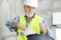 senior mason working with trowel and bucket Royalty Free Stock Photo