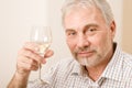 Senior mature man with glass of white wine Royalty Free Stock Photo