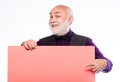Senior means experienced. Senior man recommend something. Senior holding blank sign board and looking at camera. Elderly Royalty Free Stock Photo