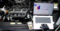 Senior Mechanic Analyzing Engine Issues With Laptop Royalty Free Stock Photo