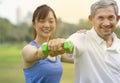 senior man doing rehabtability with daughter in the park Royalty Free Stock Photo