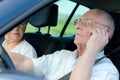 Senior man driver calling at same time Royalty Free Stock Photo
